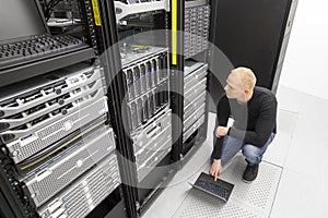 It consultant working with blade servers in datacenter
