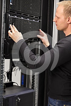 It consultant working with installation of a server in datacenter