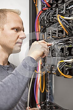 IT consultant working with network switches