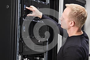 It consultant working with servers in datacenter