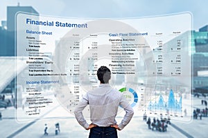 Consulting auditor analyzing Financial Report with Balance Sheet, Income Statement and Cash Flow information. Consultant auditing photo