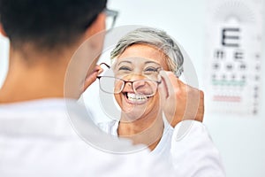 Consulting, optometry and glasses with old woman and doctor for eye care, medical and lens. Healthcare, ophthalmology