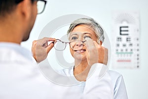 Consulting, optometry and medical with old woman and doctor for eye care, glasses and lens. Healthcare, ophthalmology