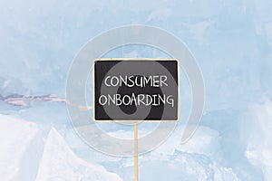 Consumer onboarding symbol. Concept words Consumer onboarding on beautiful yellow black blackboard. Beautiful blue ice background