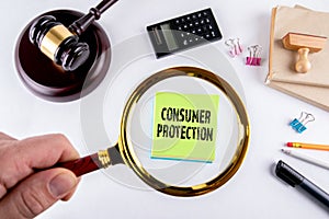 Consumer protection, Law and justice concept. Hand, holding magnifying glass
