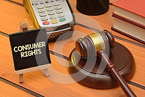 Consumer rights theme with wooden gavel on table, law background