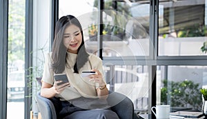 Consumer woman hand holding a mock up credit card, ready to spending pay online finance shopping according to discount products