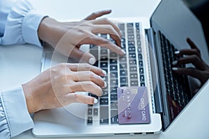 Consumer woman hand use laptop , Ready to a mock up credit card spending pay online finance shopping according to discount