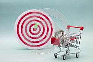 Consumerism concept. Shopping cart and target