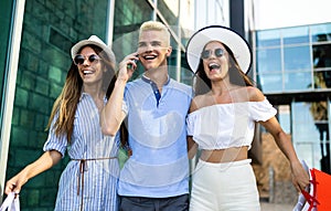 Consumerism, love, dating, travel concept. Happy couple enjoying shopping having fun