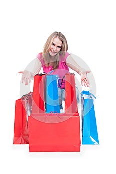 Consumerism and sale concept with cheerful woman and shopping ba