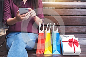 Consumerism, shopping, lifestyle concept, Young woman sitting ne