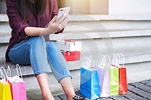 Consumerism, shopping, lifestyle concept, Young woman sitting ne