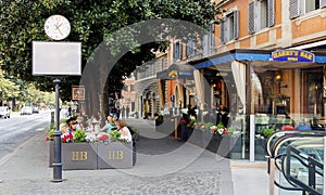 Consumers and tourists relaxing at famous Harry`s Bar in Via Ven