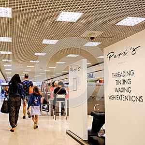 Consumers Walking Through a Shopping Mall