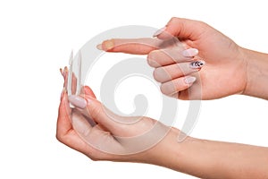 Contact eye lens. Close-up of woman holding white eye lense on finger.