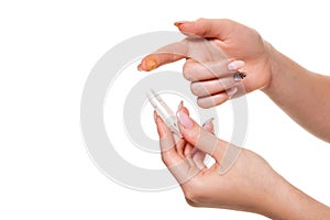 Contact eye lens. Close-up of woman holding white eye lense on finger.