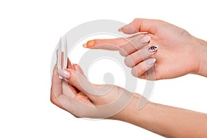 Contact eye lens. Close-up of woman holding white eye lense on finger.