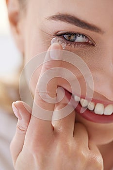 Contact Eye Lens. Smiling Woman Applying Eye Contacts on her Eyes