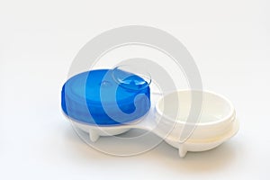 Contact lens on contact lens case on white background. Soft focus. Macro. Opthalmology and health concept