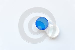 Contact lens into contact lens case on white background. Soft focus. Macro. Opthalmology and health concept