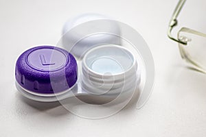 Contact lens container with contact lenses as optic alternative to glasses correct eyesight diseases like farsightedness