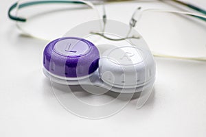 Contact lens container with contact lenses as optic alternative to glasses correct eyesight diseases like farsightedness photo