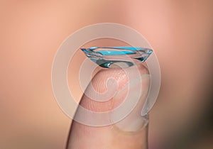 Contact lens on a finger