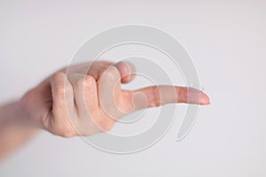 Contact lens on forefinger