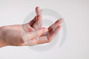 Contact lens on middle finger