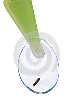 Contact lens with mote in tweezers photo