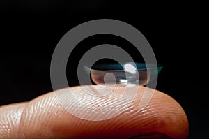 Contact lense on finger
