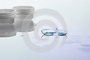 Contact lenses and case on white background. Eye health and care, eyesight and vision, ophthalmology and optometry