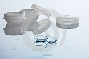 Contact lenses and case on white background. Eye health and care, eyesight and vision, ophthalmology and optometry