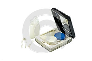 Contact lenses set with a container, bottles and tweezers isolated on white