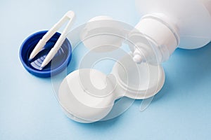 Contact lenses, solution bottle and lens storage container. Close up. Selective focus