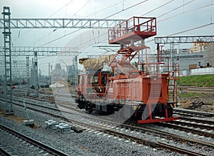 Contact network repair on railway junction, locomotive with repair platform on the rails
