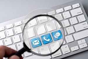 Contact us business icon on computer keyboard in retro style