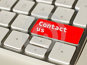 Contact us button on a computer keyboard.