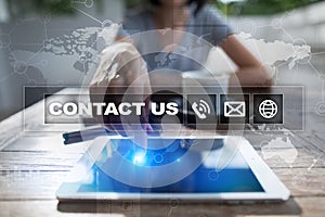 Contact us button and text on virtual screen. Business and technology concept