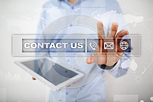 Contact us button and text on virtual screen. Business and technology concept.