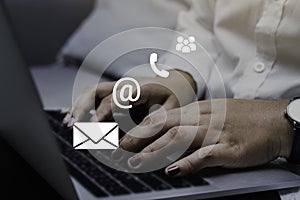 Contact us or Customer support hotline people connect. Businessman using a laptop with the email, call phone, mail icons