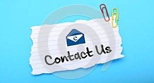 Contact us with email Icon on white paper