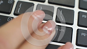 Contact us in German button on computer keyboard, female hand fingers press key