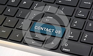 Contact Us Word on Laptop keyboard closeup