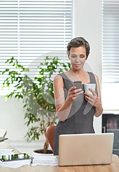 Contacting some people during her coffee break. a mature businesswoman at work in her office.