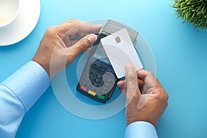 contactless payment concept with person hand paying with credit card