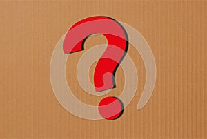 question sign on brown paper
