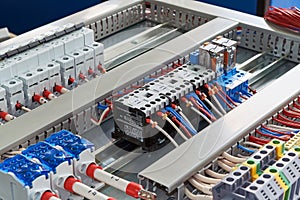 Contactors, relays, circuit breakers and terminals in the electrical Cabinet.