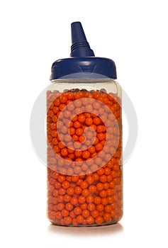 Container of bb bullets isolated on a white background photo